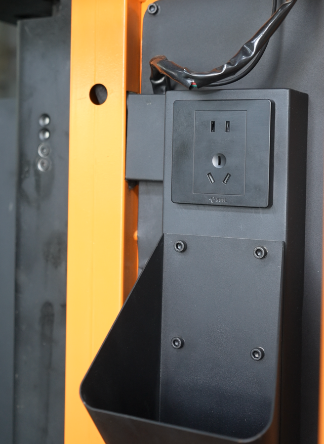K65 power outlet and storage bin
